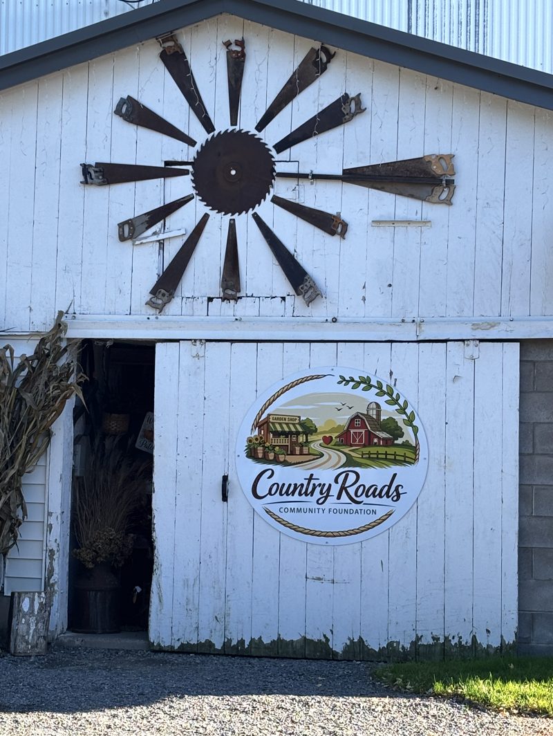 Country Roads Community Foundation sign on the barn door