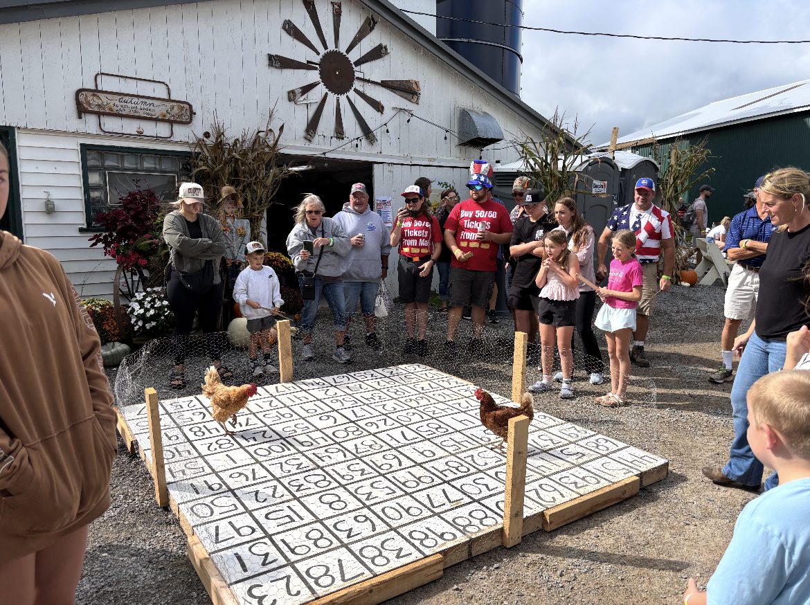 Crowd gathered around the chicken bingo board at the Fall Fundraiser