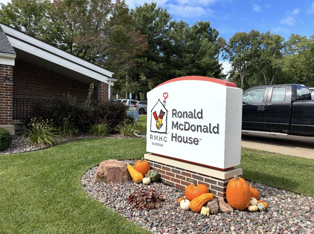 Ronald McDonald House sign surrounded by pumpkins